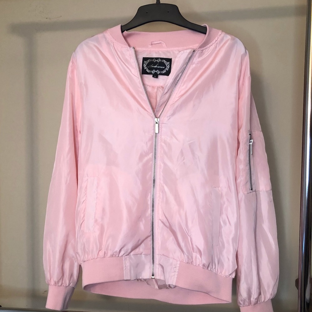 This is a pink bomber jacket.